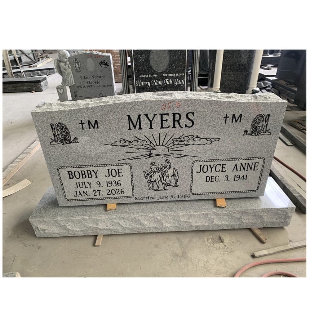 Gray granite companion upright monument with twin engraved hearts, set at a Texas cemetery