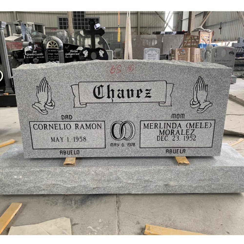 Gray granite companion upright monument with side-by-side inscriptions, set at a Texas cemetery