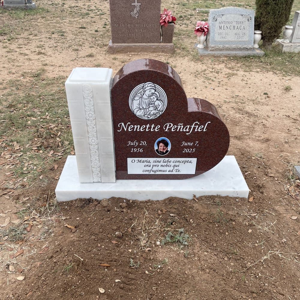 Light granite single upright monument with a heart-shaped photo inlay, set at a Texas cemetery